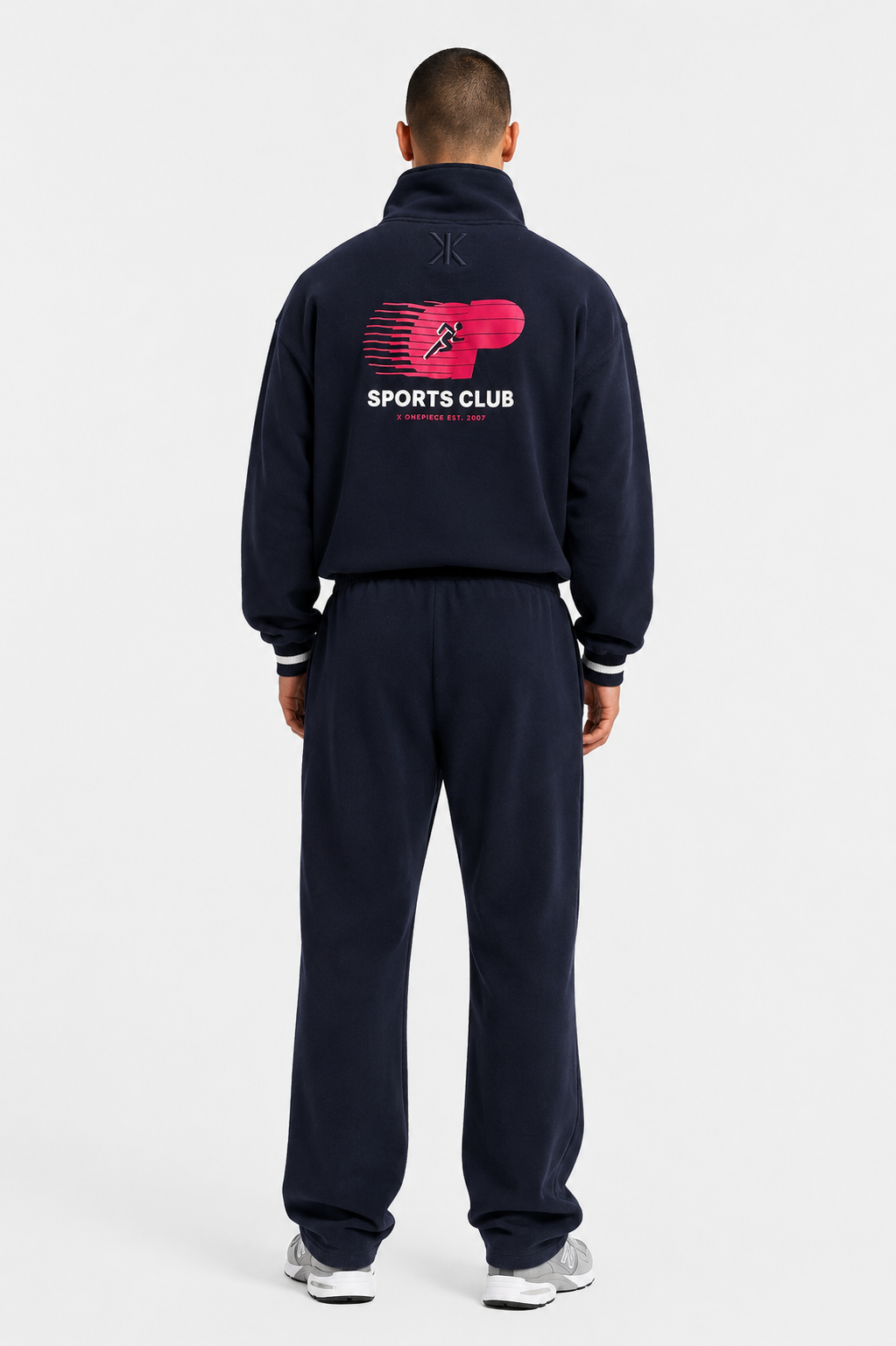 90s Sporty Jumpsuit in navy, full-length back view showing Sports Club graphic