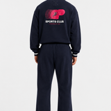 90s Sporty Jumpsuit in navy, full-length back view showing Sports Club graphic