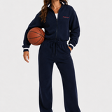 90s Sporty Jumpsuit in navy, full-length front view on female model with basketball