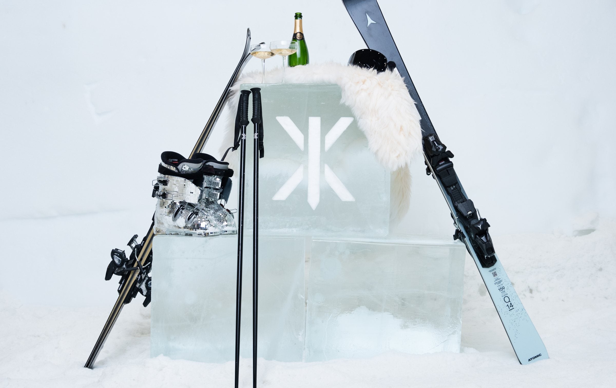 Onepiece ice block with skis and champagne